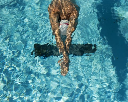 high-angle-of-male-swimmer-in-the-water-pool